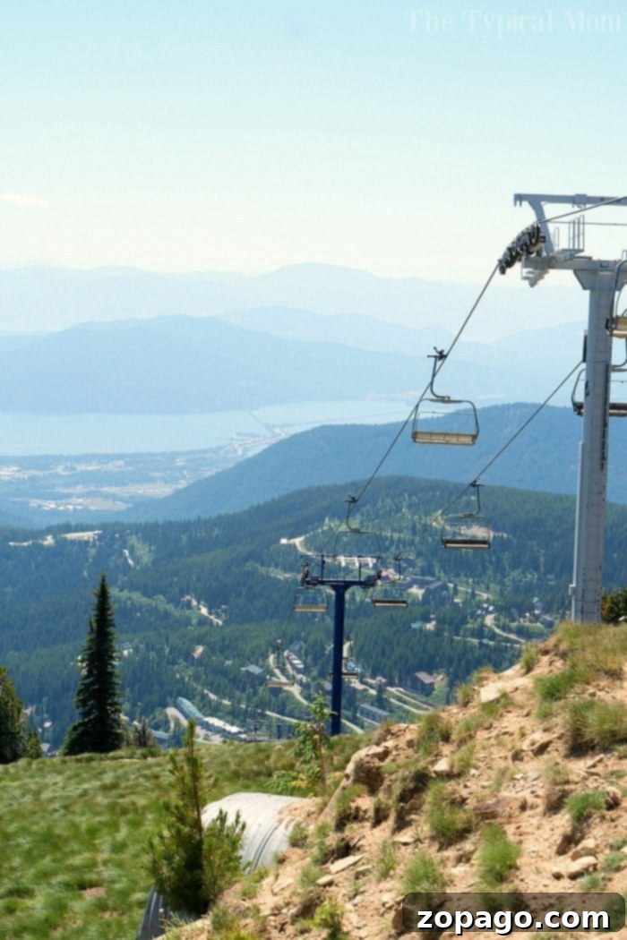 Scenic chairlift ride offering stunning views at Schweitzer Resort. Family riding a scenic chairlift at Schweitzer in summer