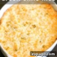 A bubbling white casserole dish reveals a golden crust, nestled over the savory delight of green chile rice beneath.