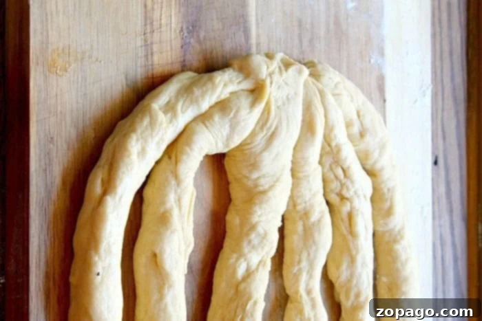Mastering Braided Challah 5 three strands of challah dough ready for braiding
