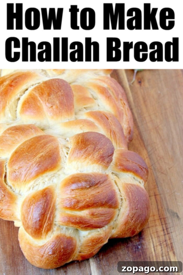 Perfect Braided Challah 5 Two golden-brown challah loaves, one intricately braided and the other shaped into a round, sitting on a wooden cutting board