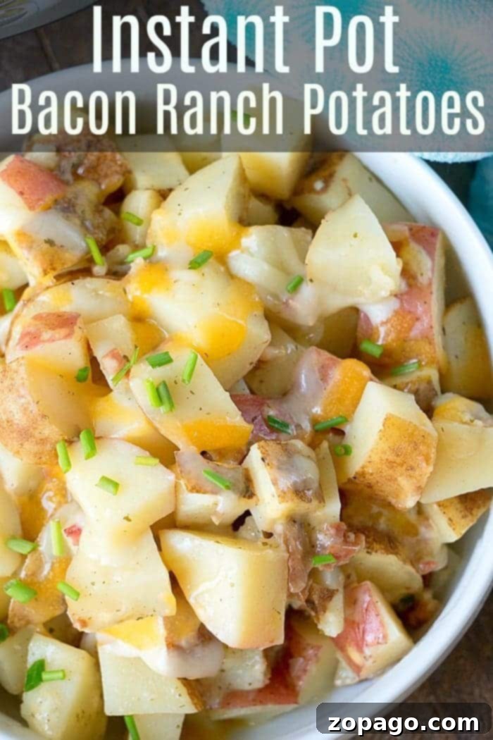 These easy Instant Pot cheesy bacon ranch potatoes are an amazing side for any meal. Red cheesy potatoes, ready to be served from the Instant Pot, a fantastic side dish.