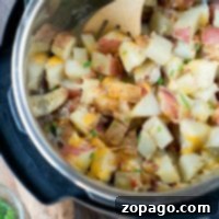 In your Instant Pot, create a delicious blend of cheesy bacon ranch potatoes by stirring diced potatoes with cheese and bacon using a wooden spoon.