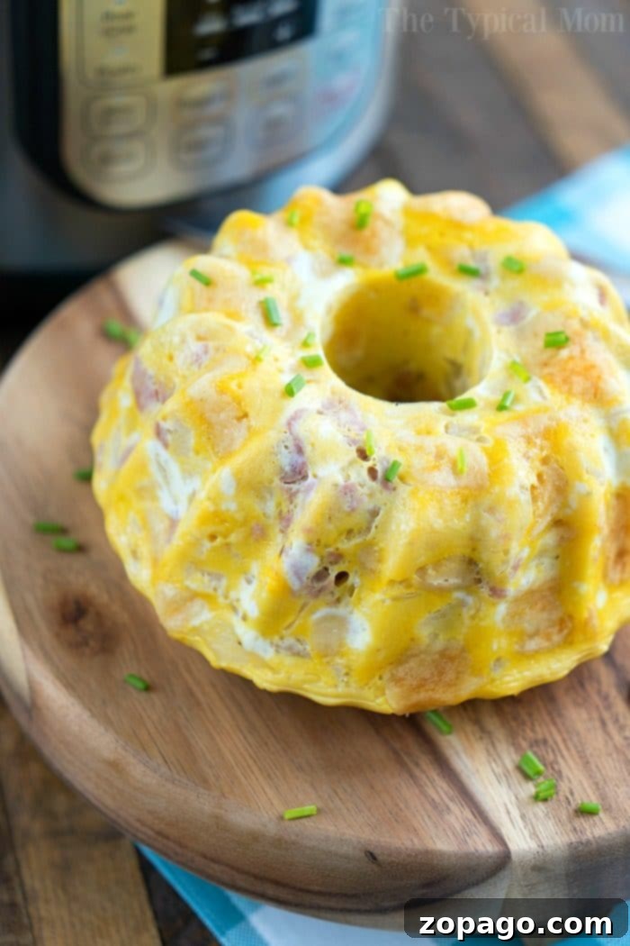 Instant Pot breakfast bundt cake full of eggs, biscuits, ham & more! Load it up and enjoy it for brunch. 30 minutes in your Instant Pot! #pressurecooker #instantpot #breakfast #cake #bundtcake #egg #brunch #bread Pressure Cooker Breakfast Bundt Cake 3