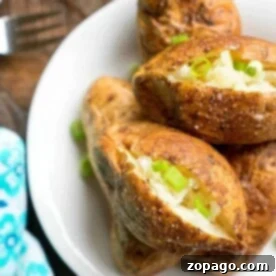 Baked potatoes on a white plate, topped with butter and chopped green onions, add a delightful touch to any meal. For those who prefer smoking their potatoes, understanding how long to smoke potatoes at 250 can enhance the flavor and texture beautifully.