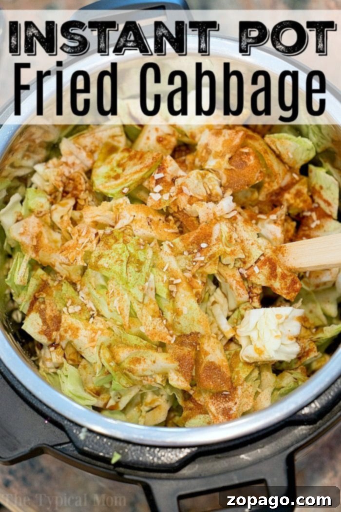 Pressure cooker fried cabbage is amazing! If you love cabbage and bacon you will enjoy this. Love my Instant Pot! #instantpot #instantpotrecipes #pressurecooker #bacon #friedcabbage #cabbage #thetypicalmom A close-up of pressure cooker fried cabbage, showcasing the tender cabbage leaves mixed with bacon and seasonings.