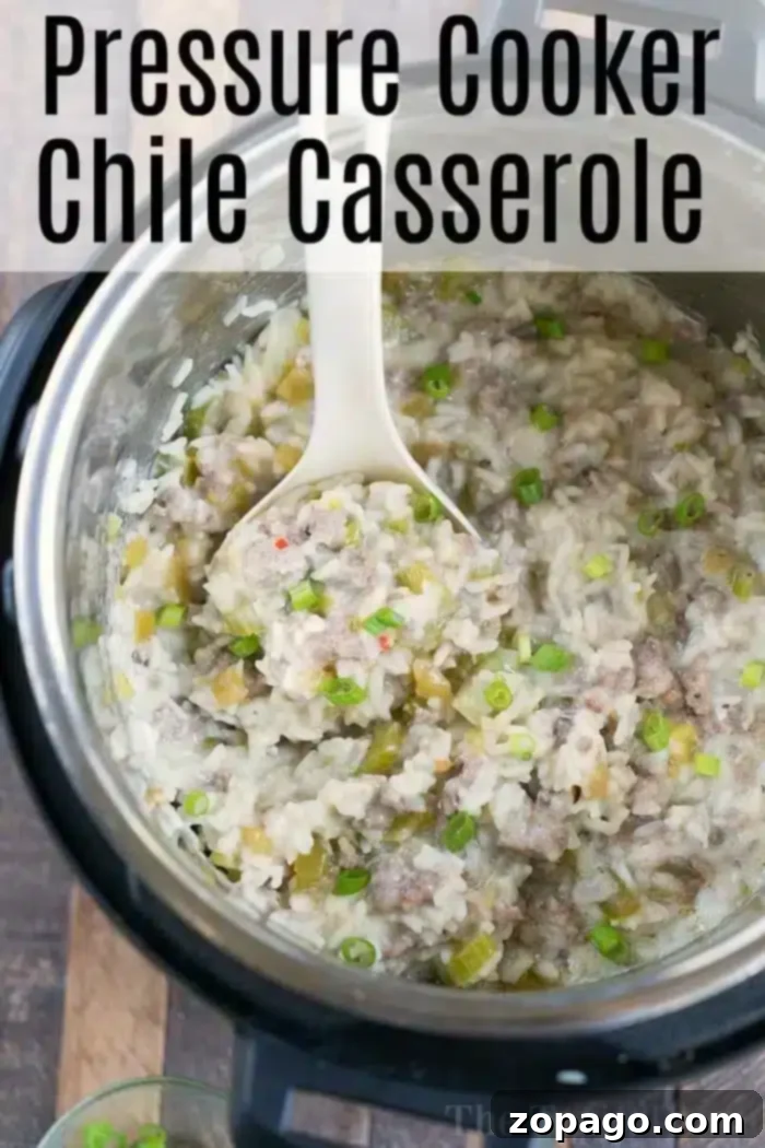 Instant Pot Sausage Rice Casserole Close Up An Instant Pot filled with a sausage rice casserole brimming with minced meat and chopped green vegetables. A spoon rests within, and the dish is garnished with sliced green onions. The words "Pressure Cooker Chile Casserole" appear at the top.