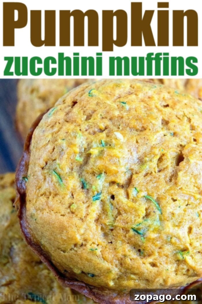 Best Pumpkin Zucchini Muffins: A Fall Delicacy A close-up of a stack of fluffy pumpkin zucchini muffins, highlighting their texture and the warm autumn spices.