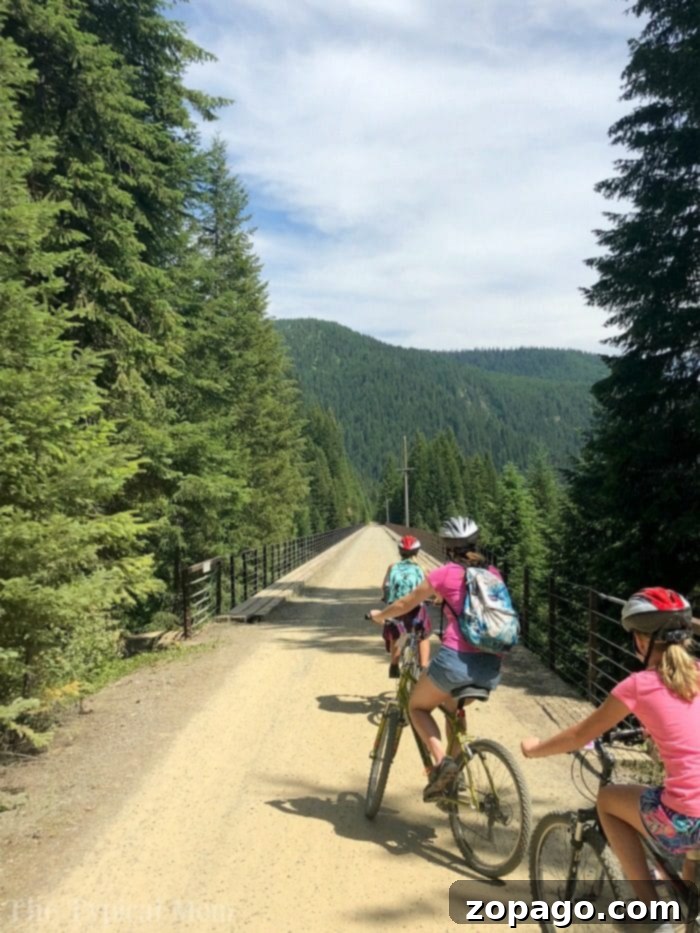 Views of the Hiawatha bike trail are here from a family who travels together a lot! North of Couer d'Alene this is an epic bike ride you have got to take. #hiawatha #bike #trail #route #pictures #video #idaho #best #couerdalene #north Family Riding through Hiawatha Bike Trail Tunnel