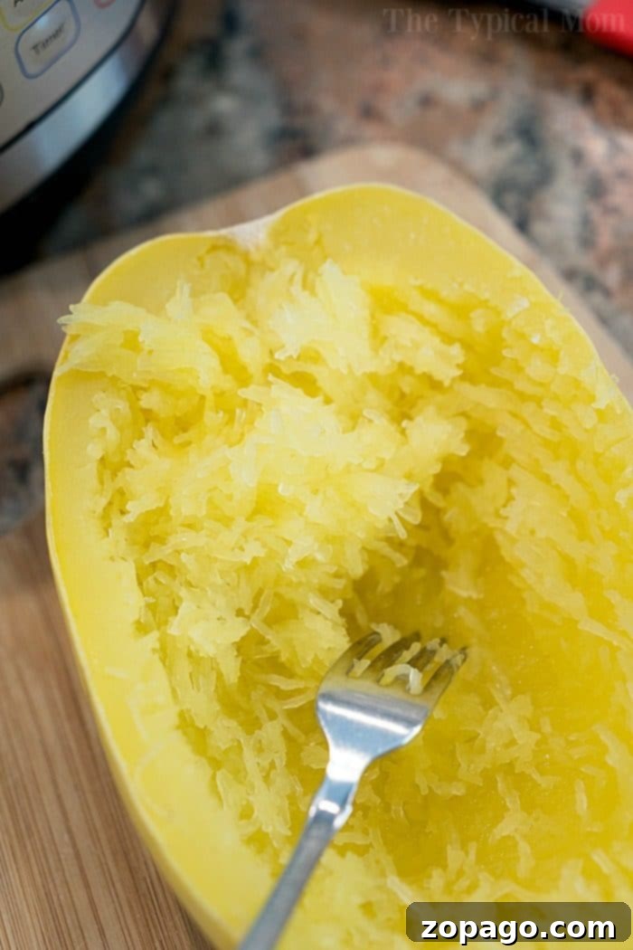 Instant Pot Spaghetti Squash in 7 minutes, a healthy and gluten-free alternative to pasta. #spaghettisquash #instantpot #healthyeating #glutenfreerecipes Instant Pot Spaghetti Squash with sauce