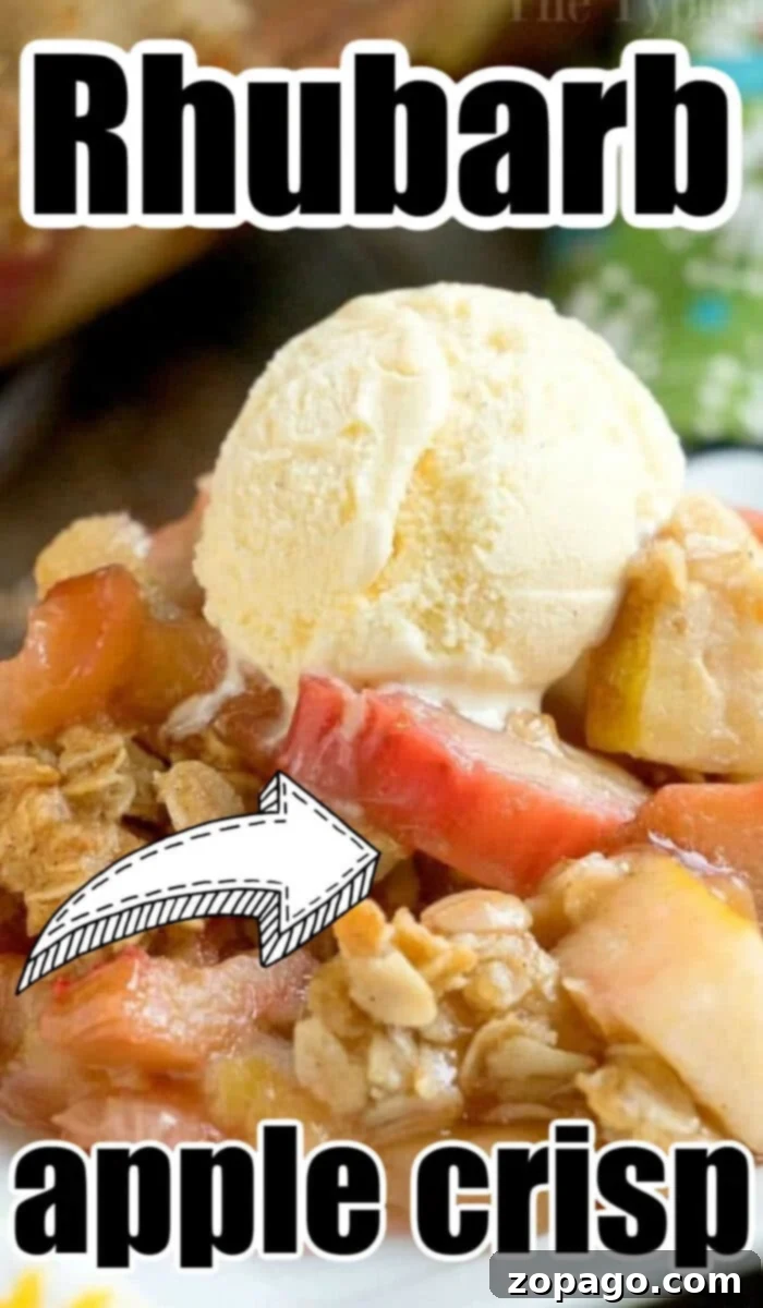 Sweet and Tangy Apple Rhubarb Crisp 3 A wide shot of a baked apple rhubarb crisp in a baking dish, garnished with fresh rhubarb stalks.