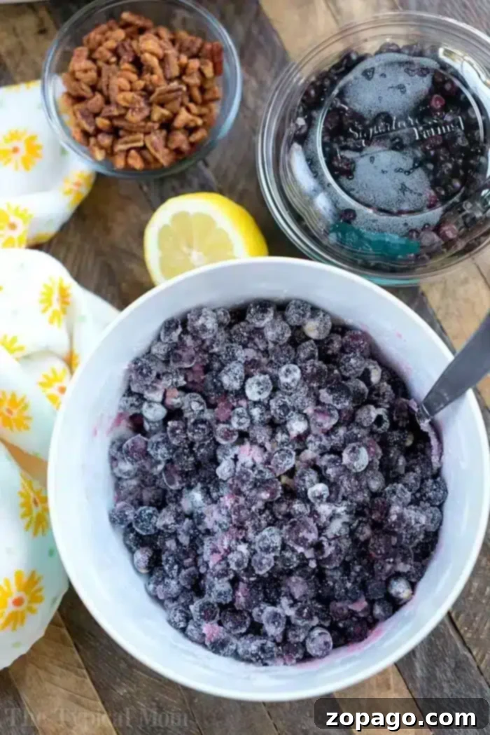 Rapid Pressure Cooker Jam 4 Fresh huckleberries, a lemon half, and a glass jar, perfect for making homemade jam.