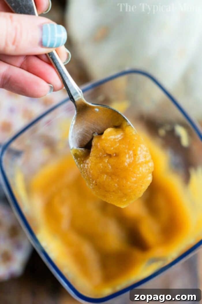 Discover how to cook fresh pumpkin quickly and easily, then turn it into the most delicious Instant Pot homemade pumpkin butter in just 20 minutes! Perfect as a spread for toast and so much more! #instantpot #pressurecooker #pumpkin #pumpkinbutter #homemade #fresh Fresh pumpkin slices being prepared on a cutting board, ready for cooking.