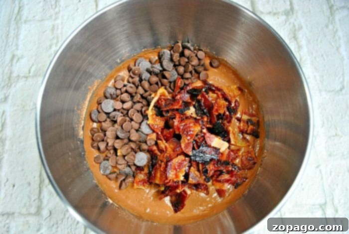 Try this rum bundt cake this Christmas and see if it's your favorite holiday dessert too! Topped with bacon with a rich chocolate flavor it's so yummy. #rum #cake #bacon #bundtcake A freshly baked spiced rum bundt cake, still warm and inviting.