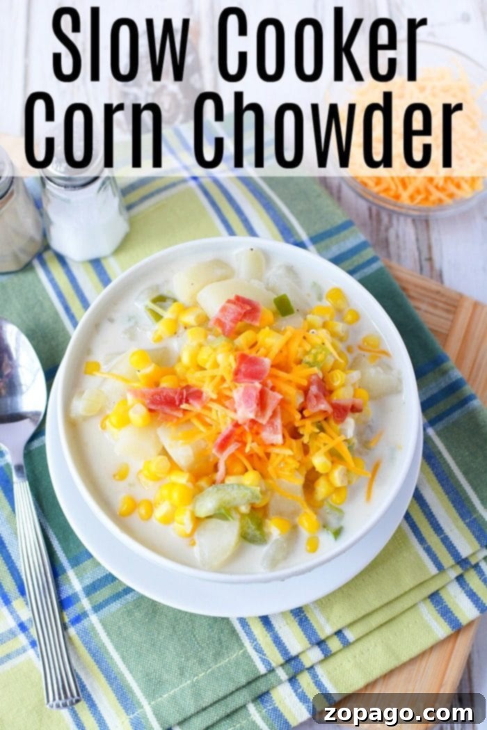 Crockpot corn chowder with potatoes and bacon recipe. Perfect soup for dinner packed with lots of vegetables and flavor! #crockpot #slowcooker #corn #chowder #potato #bacon #soup #crockpotrecipes #thetypicalmom Large pot of crockpot corn chowder ready to be served, showing its thick and creamy texture.