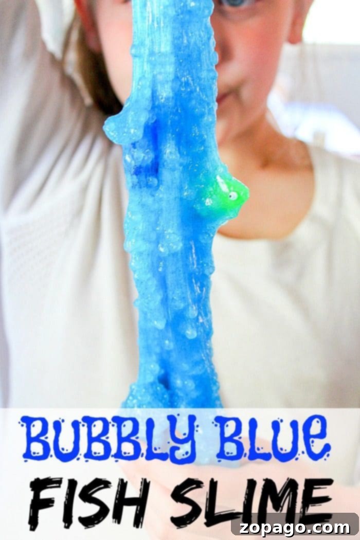 Easy Borax-Free Fish Slime for Kids: A Safe & Fun DIY Craft Vibrant blue borax-free fish slime for kids with miniature fish toys, perfect for ocean-themed play.