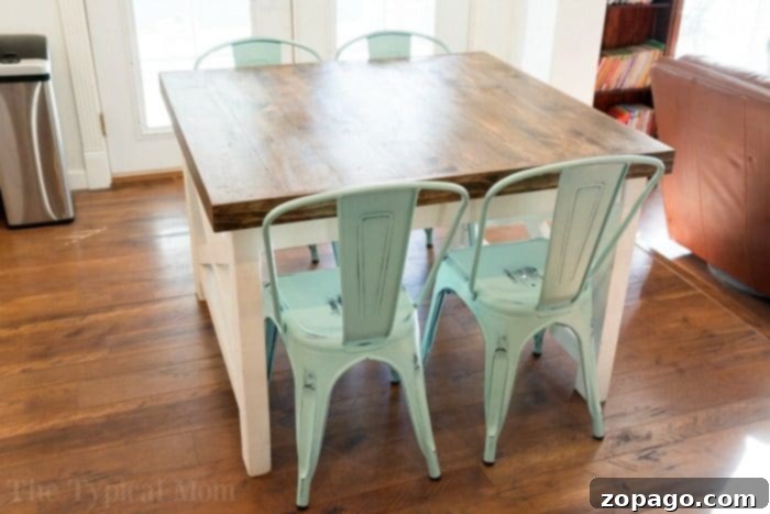 Custom Farmhouse Dining Table with Vibrant Turquoise Chairs Farmhouse dining area with custom table and turquoise chairs
