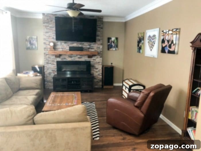 The dark and uninviting living room before its shiplap transformation. Dated living room before shiplap installation with dark brown walls