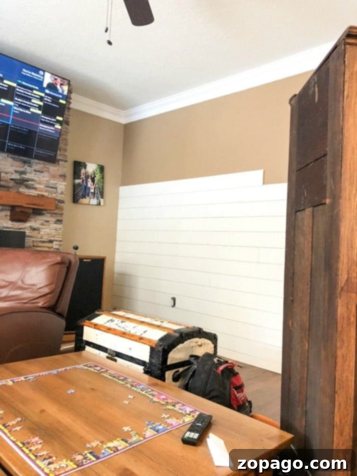 DIY Shiplap Accent Wall Progress Shots Close-up of shiplap accent wall installation, showing detail