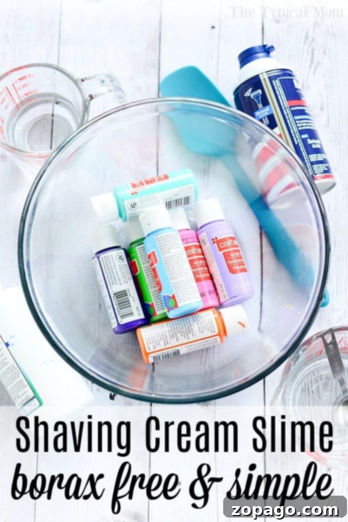 Giant Fluffy Slime made with shaving cream: A fun and tactile sensory activity. Child's hands stretching a large blob of vibrant, fluffy blue slime