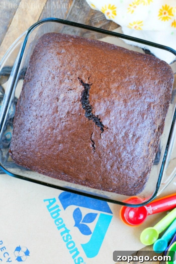 Decadent Coca-Cola Chocolate Cake 4 Coca-Cola Chocolate Cake baking in a 13x9 pan, ready to be frosted.