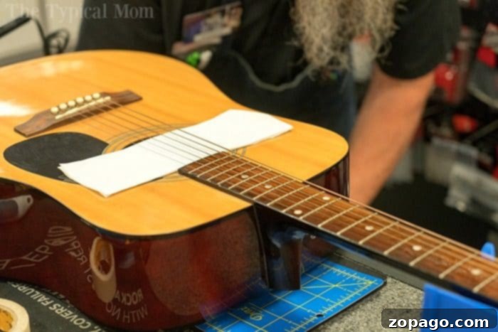 Dedicated Guitar Instructors: Guiding Students Through Every Chord and Melody An instructor patiently guiding a student through guitar chords during a private lesson at Guitar Center.