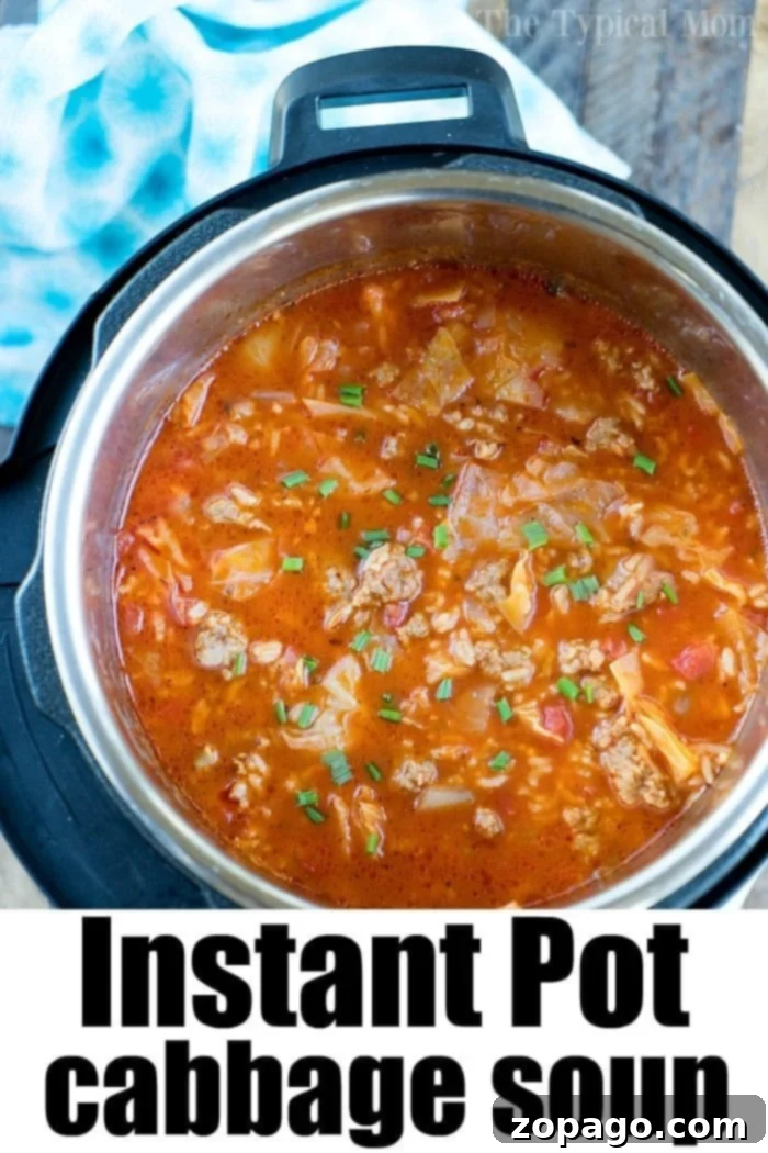 A vibrant close-up of pressure cooker cabbage soup, showcasing the hearty ingredients. Close-up of Pressure Cooker Cabbage Soup with Sausage