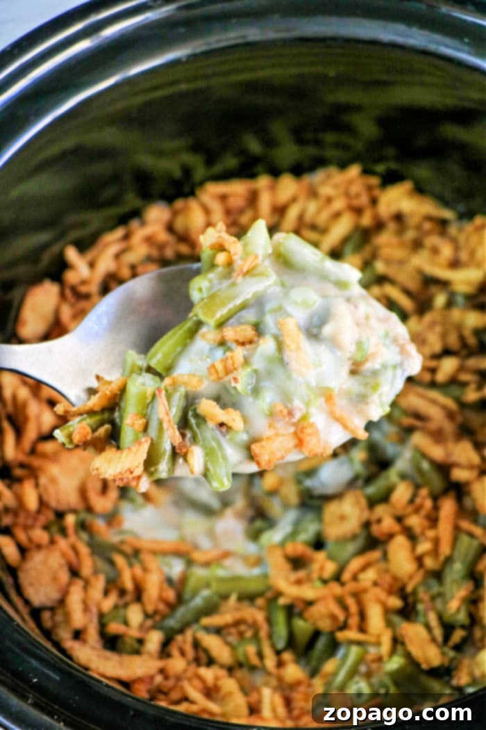Great crockpot side dishes for Thanksgiving that range from traditional to updated ideas. Baked and mashed potatoes in the crockpot this year. Creamy Slow Cooker Green Bean Casserole with golden crispy fried onions on top