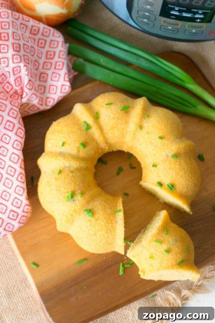 A golden-brown pressure cooker cornbread, freshly baked and ready to serve.