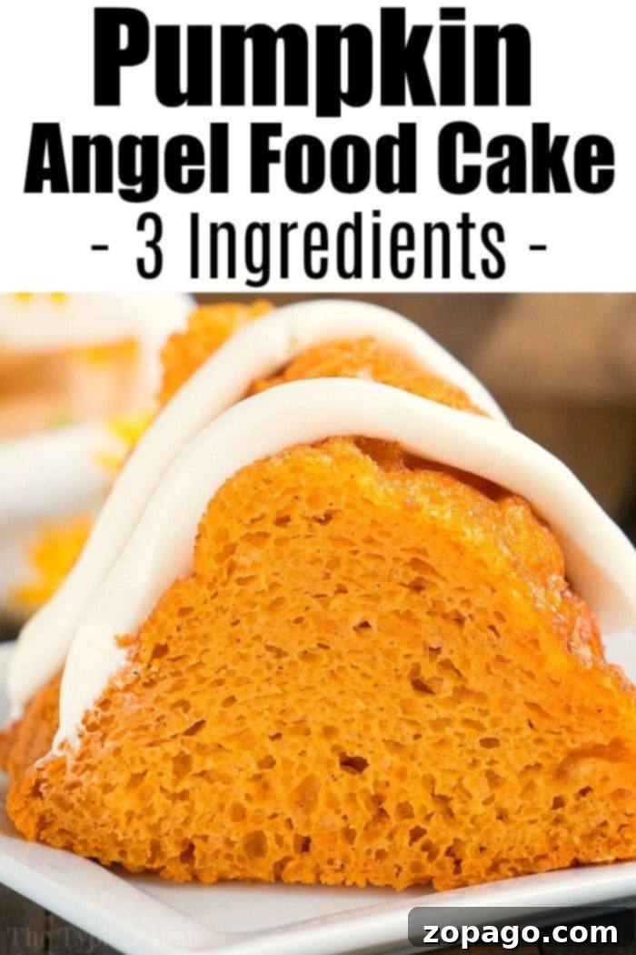 Enjoy a slice of Pumpkin Angel Food Cake, a light and delicious fall dessert, perfect for Weight Watchers. #pumpkinrecipe #pumpkincake #pumpkinangelfoodcake #dumpcake #weightwatchers #dessert A delectable slice of pumpkin angel food cake, crowned with a swirl of white frosting, rests elegantly on a plate, ready to be enjoyed.