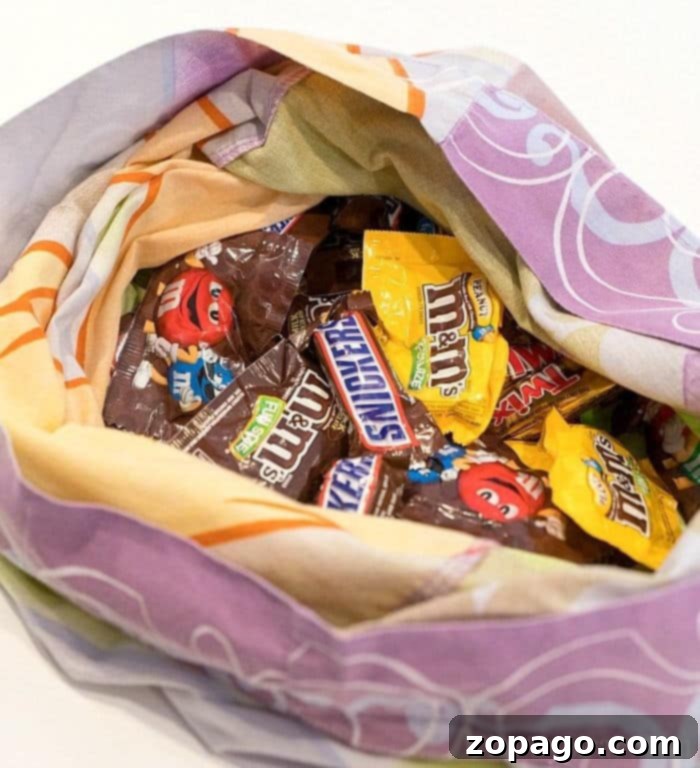Safe Halloween Fun for Kids 3 An assortment of Halloween candy, emphasizing the importance of checking treats for safety before eating.