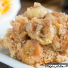 Close-up of banana dump cake, featuring caramelized bananas served on a square white plate.