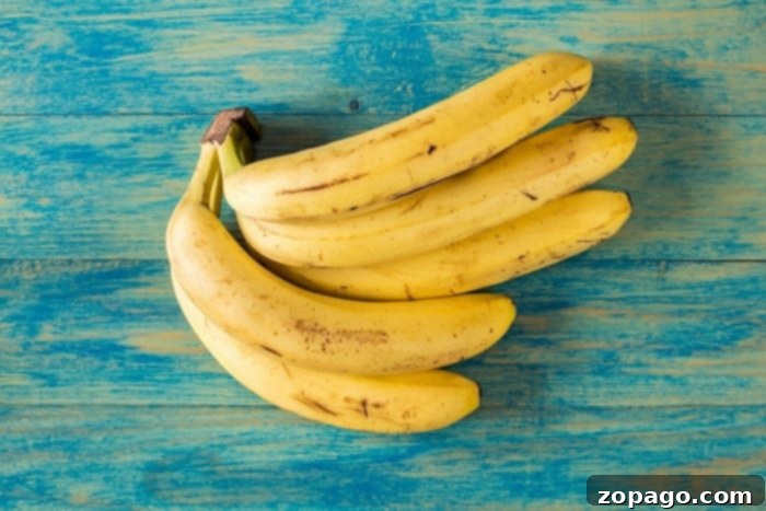Easy 4-Ingredient Banana Bread 3 A bowl filled with perfectly ripe, speckled brown bananas, ideal for banana bread.
