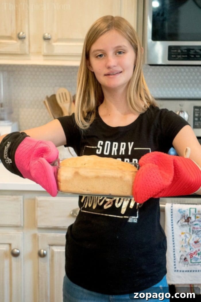 Shake & Bake Whole Wheat Bread 7 Child holding an easy bread recipe loaf