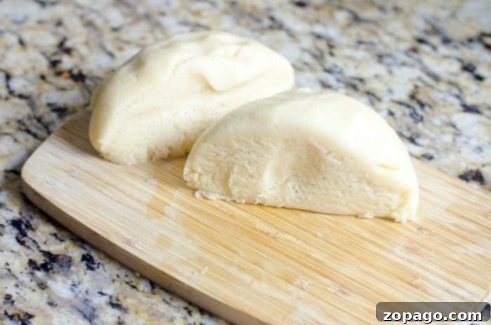 Here's an easy crinkle cookies recipe you can make for any occasion. With bright colors they're great Christmas cookies that come out moist every time. #crinklecookies #christmas #cookies Two halves of the beginnings of a crinkle cookies recipe, all placed atop a speckled countertop.