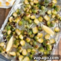 Perfectly Roasted Brussels Sprouts: 450-Degree Baking Times 2 Roasted Brussels sprouts on a foil-lined baking sheet with lemon wedges, knowing just how long to bake Brussels sprouts at 450 ensures they come out perfectly caramelized.