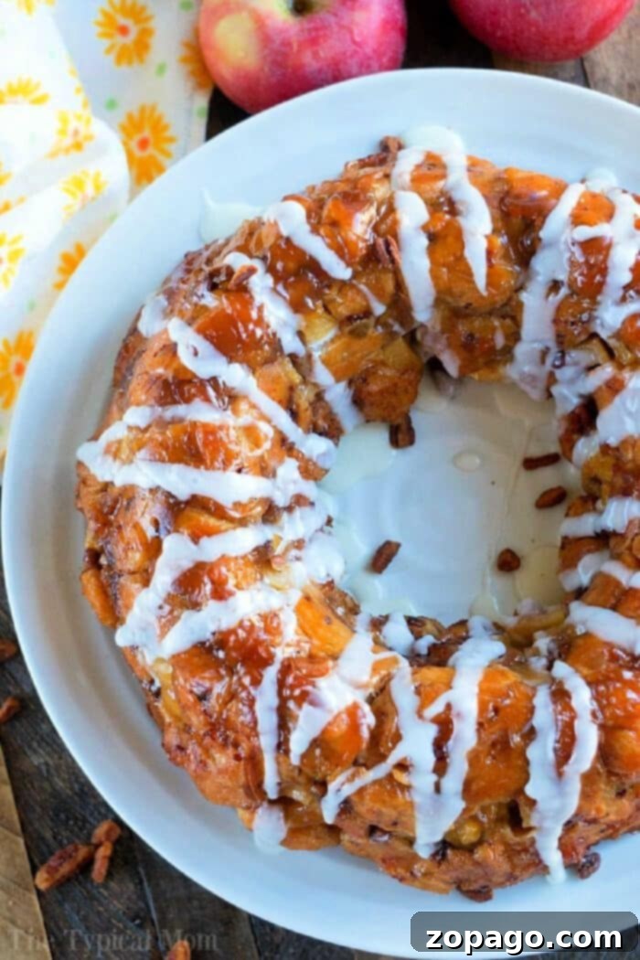 Caramel Apple Monkey Bread 2 Apple Monkey Bread with a sweet glaze, perfect for breakfast or dessert, made with fresh apples and biscuits.
