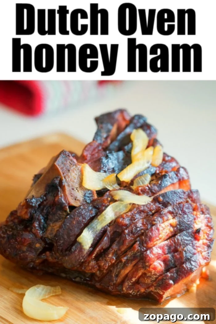 Dutch oven ham needs to go on your list of the best Dutch oven recipes this year, and with a honey glaze it is perfect for Christmas or Easter dinner. #dutchoven #ham #dutchovenrecipes #honeyham dutch oven ham