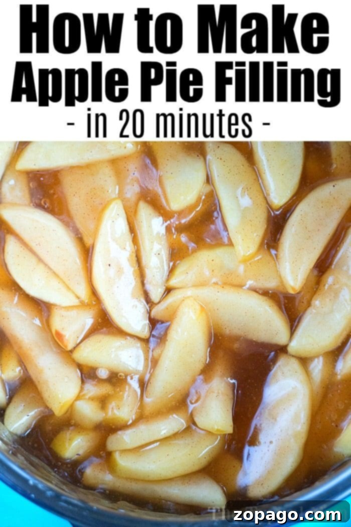 Easy homemade pressure cooker apple pie filling recipe you can make in about 20 minutes in your Instant Pot or a bit longer using our stovetop directions! #instantpot #applepiefilling #applerecipes #instantpotrecipes #pressurecooker #thetypicalmom #dessert A wide shot of a pressure cooker inner pot filled with bubbling apple pie filling, showcasing the easy apple pie filling recipe in progress, with apple slices perfectly softened in the rich, spiced sauce.