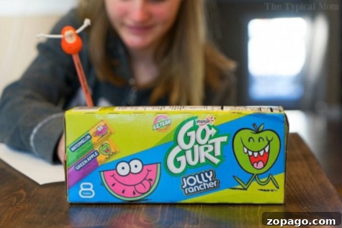 Yoplait Go-Gurt: A Delicious Winter Snack for Kids Yoplait Go-Gurt yogurt tubes featuring Jolly Rancher flavors, a fun snack for kids.