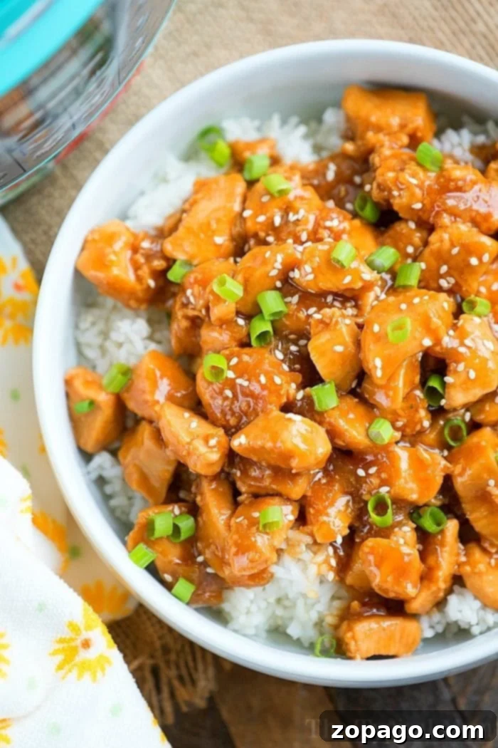 Instant Pot sesame chicken 3, served with a side of rice.