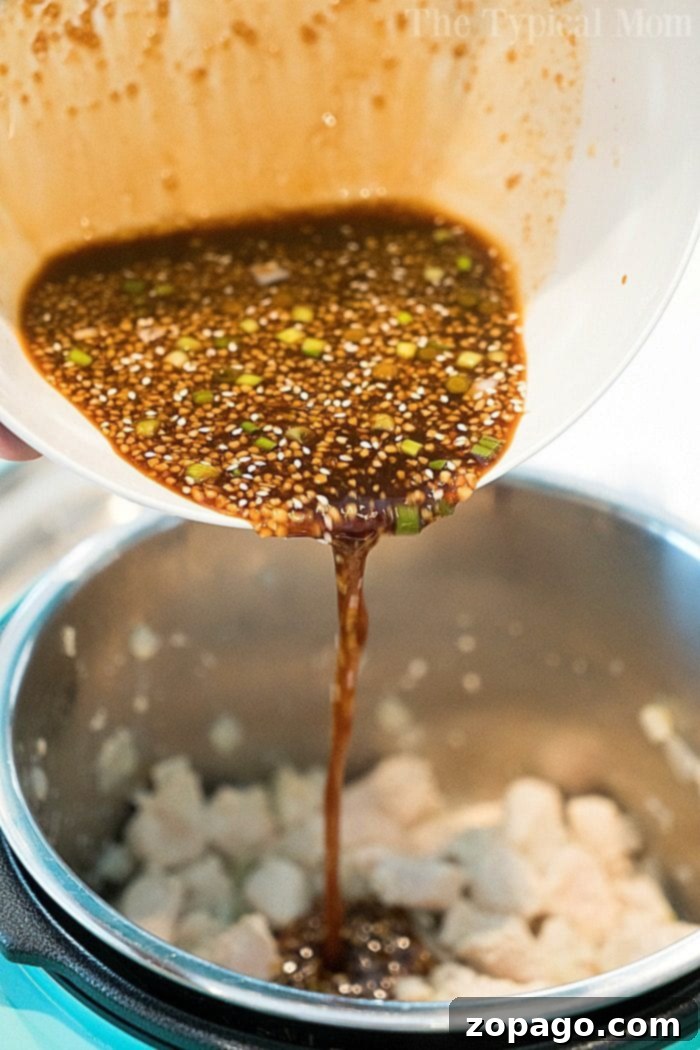 Instant Pot sesame chicken 2, garnished with green onions.