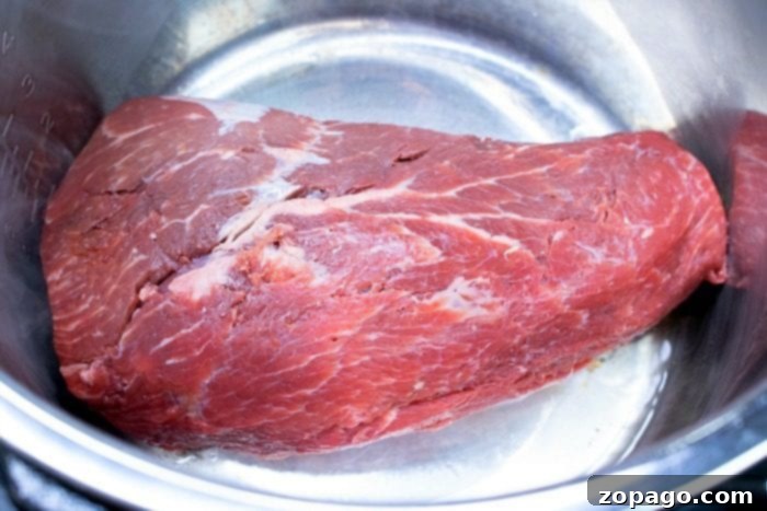 Pressure cooker roast beef is tender and full of flavor without ever having to turn on your oven! Sliced or shredded beef Instant Pot or Ninja Foodi style. Instant Pot roast beef with tender vegetables