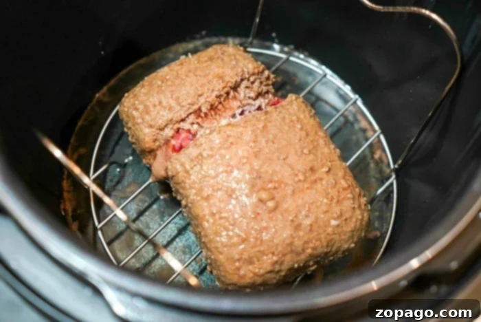 No Thaw Instant Pot Ground Beef 8 Thawed ground beef rests elegantly on a rack inside an Instant Pot, promising a flavorful delight.