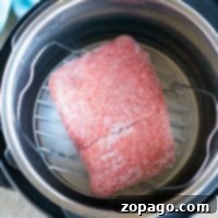 No Thaw Instant Pot Ground Beef 10 Instant Pot frozen ground beef sits on a trivet, poised for cooking perfection.