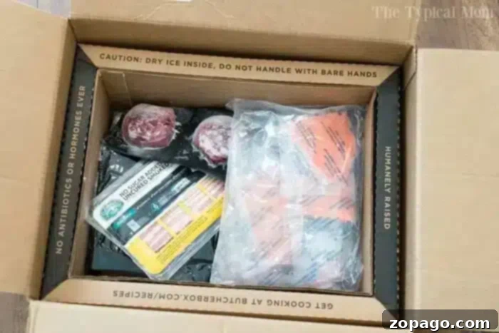ButcherBox Delivery for Quality Seafood An open ButcherBox delivery, featuring packages of ground beef, bacon, and various other meat items, perfectly illustrating quality ingredients for pressure cooker meals.