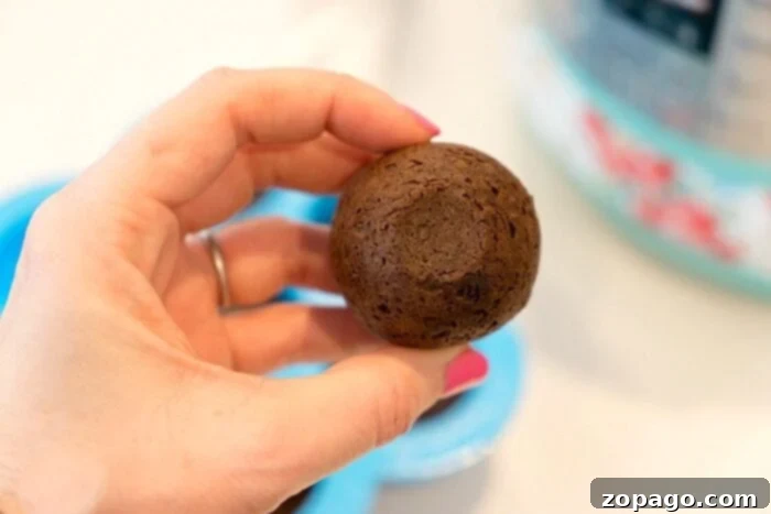 Instant Pot Donut Holes in an Egg Mold A silicone egg mold filled with raw donut batter, placed on a trivet inside an Instant Pot, ready for pressure cooking.