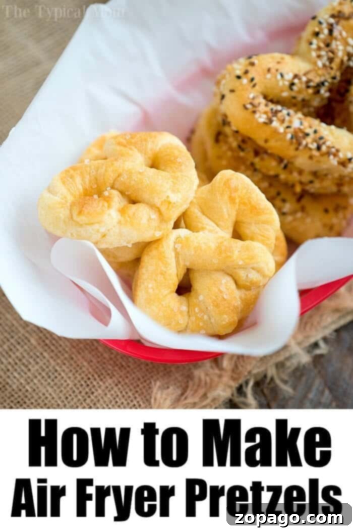 Serve these easy homemade pretzel bites with your favorite dip for a crowd-pleasing snack. A large pile of easy homemade pretzel bites on a serving tray with dipping sauce.