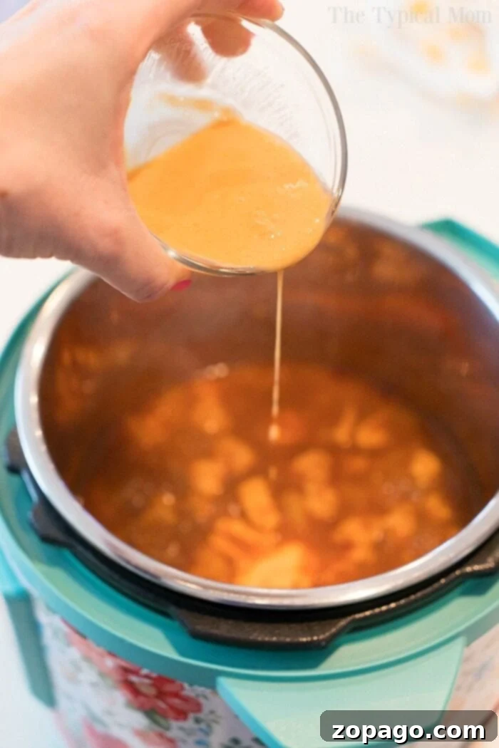 Tropical Instant Pot Chicken 4 Delicious pressure cooker Hawaiian chicken in a bowl, garnished and ready to eat