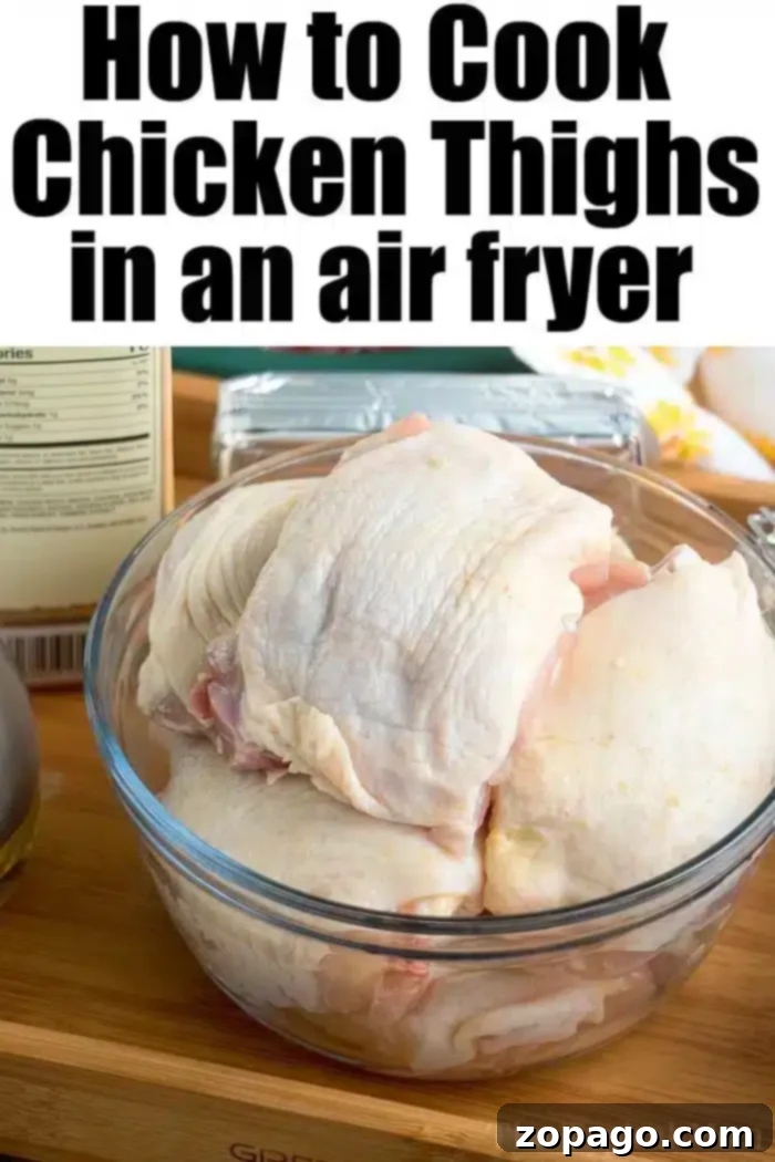 Air fryer chicken thighs ever! Use this dry rub for chicken to make sweet and crispy chicken in an air fryer that's tender and juicy inside. Yum! #airfryer #airfryer #ninjafoodirecipes #ninjafoodi #chickenthighs #chicken #crispy A clear glass bowl filled with raw bone-in chicken thighs is placed on a wooden surface. Behind the bowl, there is a package of butter, a bottle of olive oil, and other kitchen items. The text at the top reads "How to Cook Chicken Thighs in an Air Fryer.