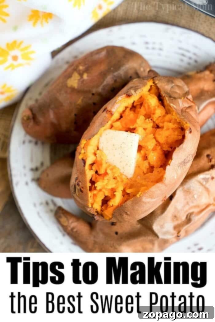 Perfect Air Fryer Sweet Potatoes 6 A perfectly cooked sweet potato topped with a slice of melting butter on a plate.